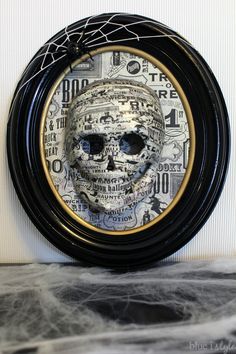 there is a clock with a skull in it on the wall next to a sign that says halloween skeleton art