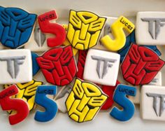 decorated cookies are arranged in the shape of letters