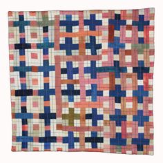 an old quilt with many squares and lines on it's sides, all in different colors