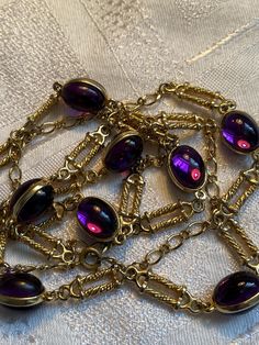 Gorgeous 80's station necklace featuring purple double cabochon links Heavily gold plated  It measures 34 inches in total length  In good condition with little wear to the gold plate  To nice to sit in the drawer 🙂 Chili Board, Purple Necklace, Station Necklace, Long Chain, Chains Necklace, Favorite Jewelry, Violet, Gold Plate, Jewelry Necklaces