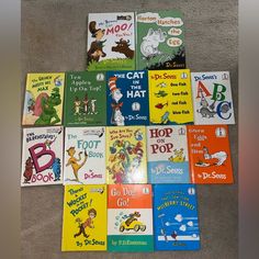 many children's books are laid out on the floor in front of each other