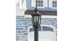 a lamp post in front of a house