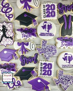 purple and white decorated cookies with graduation decorations