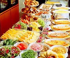 a buffet table filled with lots of food