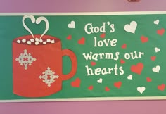 a sign that says god's love warms our hearts with a cup of hot chocolate