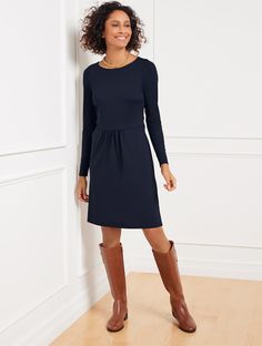 We’re famous for this easy-care, easy-wear, jersey fabric! Beautiful dresses in every silhouette. Body slimming. Simple to slip into. Perfectly packable–just right for work and travel. Features Fit & Flare Dress Jewel Neck Long Sleeve Pull on closure Hits Above Knee Imported Fit: Misses: 36 1/4"; Petite: 34 3/4"; Plus:40"; Plus Petite: 37 3/4" Material: 93% Nylon, 7% Spandex Care: Machine Wash Cold; Turn Garment Inside Out; Only Non-Chlorine Bleach When Needed; Tumble Dry Low; Cool Iron, If Needed | Effortless Jersey A-Line Dress - Indigo Blue Talbots Talbots Outfits, Long Quilted Coat, Suede Trench Coat, Work And Travel, Funnel Neck Sweater, Classic Style Women, Jewel Neck, Indigo Blue, Wool Blazer