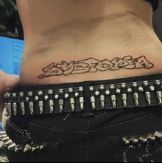 a woman with a tattoo on her stomach