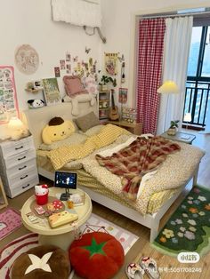 a bed room with a neatly made bed and lots of decorations on the wall above it