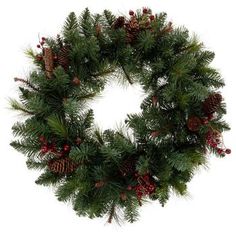 a christmas wreath with pine cones and berries