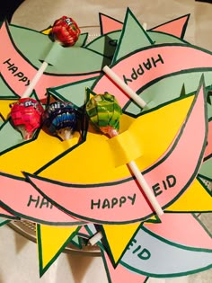 a table topped with lots of candy and lollipops on top of each other