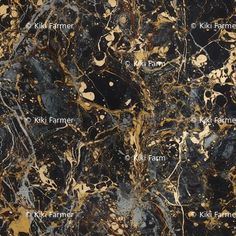 black and gold marble with names on it