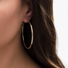 Curate her collection of versatile accessories with these continuous tube hoop earrings, a classic look that pairs well with her casual and dressy attire. Crafted in 14K gold Each simple earring gleams with a 50.0 x 2.0mm continuous tubular hoop. These earrings make a great fashion staple. These hoop earrings secure with hinged backs. Golden Hoop Earrings Aesthetic, Gold Hope Earrings, Hoop Earrings Aesthetic, Gold Hoops Earrings, Emily Prentiss, Tube Hoop Earrings, Dressy Attire, Golden Hoops, Casual Earrings