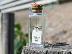 a message in a bottle that says thank you so very today on it with a bow