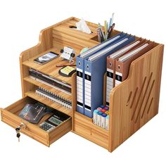 a wooden desk with many files and folders in the drawer on top of it