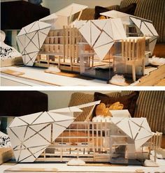 two pictures of a model house on a table with wood sticks in front of it