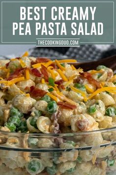 the best creamy pea pasta salad is in a glass bowl and ready to be eaten