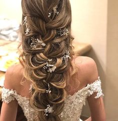 a woman with long hair in a wedding dress