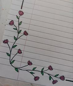 a piece of lined paper with flowers drawn on it and a pencil in the middle