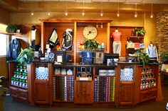 the inside of a golf shop with lots of items on display in front of it