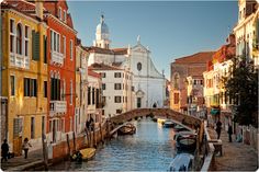 a canal with boats and buildings on both sides