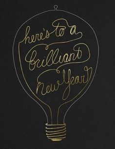 there's to a brilliant new year written in gold ink on a black background