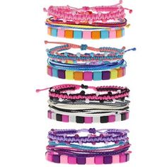 several different colored bracelets stacked on top of each other