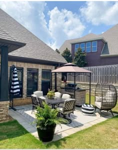 a patio with chairs and an umbrella on it