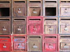 many mail boxes are stacked on top of each other