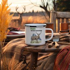 a coffee mug sitting on top of a wooden table