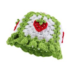 a green and white crocheted hat with a red heart