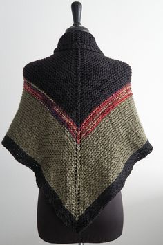 a knitted shawl on a mannequin head