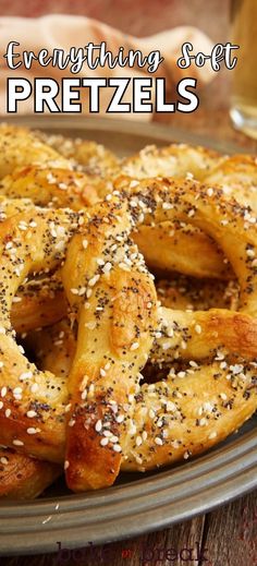 a plate full of pretzels with sesame seeds on them and the words everything soft pretzels