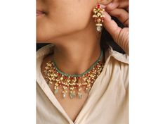 This stunning gold-tone Jadau Kundan jewelry set features ruby red, pink, and green Kundan stones, accented with small pearls, mint green onyx beads, red pumpkin beads, and pastel green strawberry beads. Paired with matching earrings, this Polki Kundan necklace is perfect as a green Kundan necklace, ruby Kundan necklace, or Victorian Kundan necklace. Jadau Kundan earrings, Jadau Kundan necklace set, Kundan pearl necklace. Necklace and Earrings Necklace Has Been Adjustable Cord Push Back Earrings Green Kundan Necklace With Round Gemstone Beads, Celebration Multicolor Gold-plated Kundan Necklace, Green Gemstone Kundan Necklace, Elegant Multicolor Dual-tone Kundan Necklace, Dual-tone Kundan Necklace For Rituals, Red Pumpkins, Kundan Jewellery Set, Gold Necklace Indian, Green Strawberry