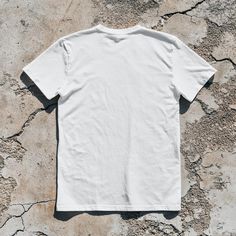 White Cotton Jersey T-shirt With Letter Print, Cotton T-shirt With Back Print, Cotton T-shirt With Back Print And Short Sleeves, Cotton Crew Neck Shirt With Back Print, White Letter Print Cotton Jersey T-shirt, Basic White Tops With Screen Print, White T-shirt With Back Print For Summer, Basic White T-shirt For Everyday, White Cotton Short Sleeve Shirt