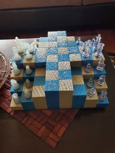 a chess board made out of wood and plastic