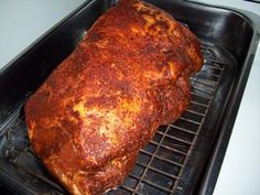 a large piece of meat is cooking on the grill in an oven with it's rack