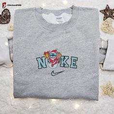 Introducing the limited edition Nike Christmas x Stitch Santa Embroidered Sweatshirt, a must-have for Disney fans and fashion enthusiasts alike! This sweatshirt features a unique and intricate embroidery of Stitch dressed as Santa, adding a touch of whimsy to your holiday wardrobe. The high-quality materials ensure comfort and durability, making it perfect for both indoor and outdoor wear. Whether you’re gifting it to a loved one or treating yourself, this sweatshirt is the best Christmas Nike Cartoon, Disney Character Shirts, Nike Inspired, Best Family Gifts, Cindy Lou, Limited Edition Shirt, Cartoon Sweatshirts, Merry Christmas Shirts, Jason Voorhees