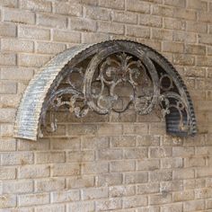 an old window on the side of a brick building