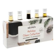 four bottles of holiday cheer collection gourmet flavored syrups in a gift box