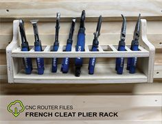 there are many different types of tools in the holder on this rack, and one is blue