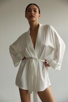 Classic kimono crafted from high quality Italian viscose with lace details. Relaxed silhouette and wide sleeves provide true comfort. Wrap yourself in true luxury.  Our model wears size XS, her measurements are 84/64/89 cm and she is 168 cm tall. Length 88 cm/34,5 inches Wedding Nightgown, Slippers Outfit, Ss 2024, Bridal Kimono, Gown Bridesmaid, Silk Dressing Gown, White Kimono, Silk Kimono Robe, Long Gown Dress