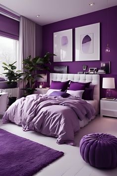 a bedroom decorated in purple and white with a large bed covered in lavender colored sheets