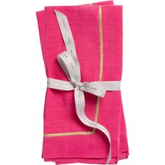 two pink napkins with white ribbon and gold trim on the edge, tied together