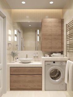 a washer and dryer in a small bathroom