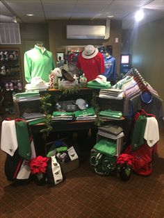 a room filled with lots of green and red items on top of a wooden table