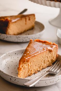 a slice of cheesecake on a plate with a fork