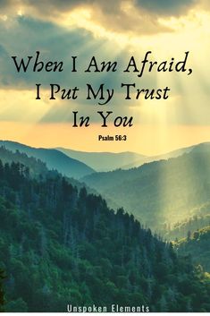 the sun shining through clouds over mountains with bible verse about when i am afraid, i put my trust in you