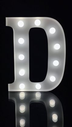 the letter d is lit up with lights