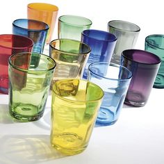 many different colored glasses are lined up together