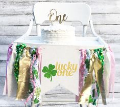 a st patrick's day themed birthday party with lucky one banner and shamrock decorations